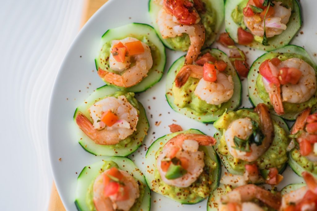 Food plate with seafood and cucumber.