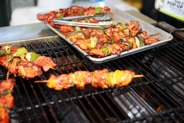 meat and vegetables on a grill in Jamaica