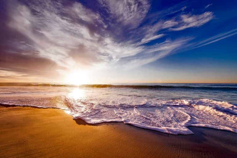 A seashore during the sunset. Beautiful beaches are only some of the young couples' favorite St. Croix locations.