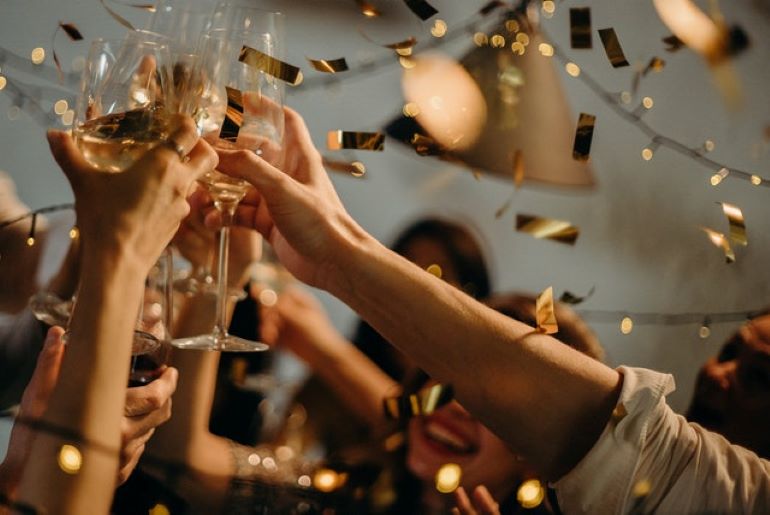 Some people are toasting.