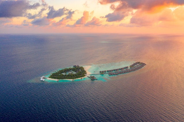 A picture of an island at the Caribbean taken with a drone.