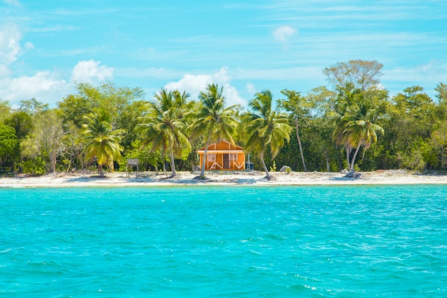 A wooden cabin on the beach. 