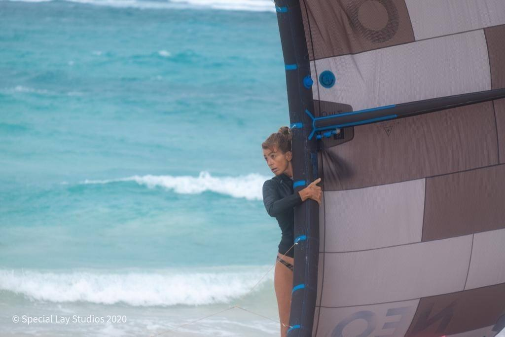 Girl holding a kite preparing for launch