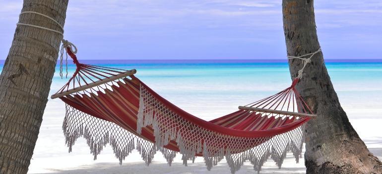 A hammock by the azure Caribbean Sea. 